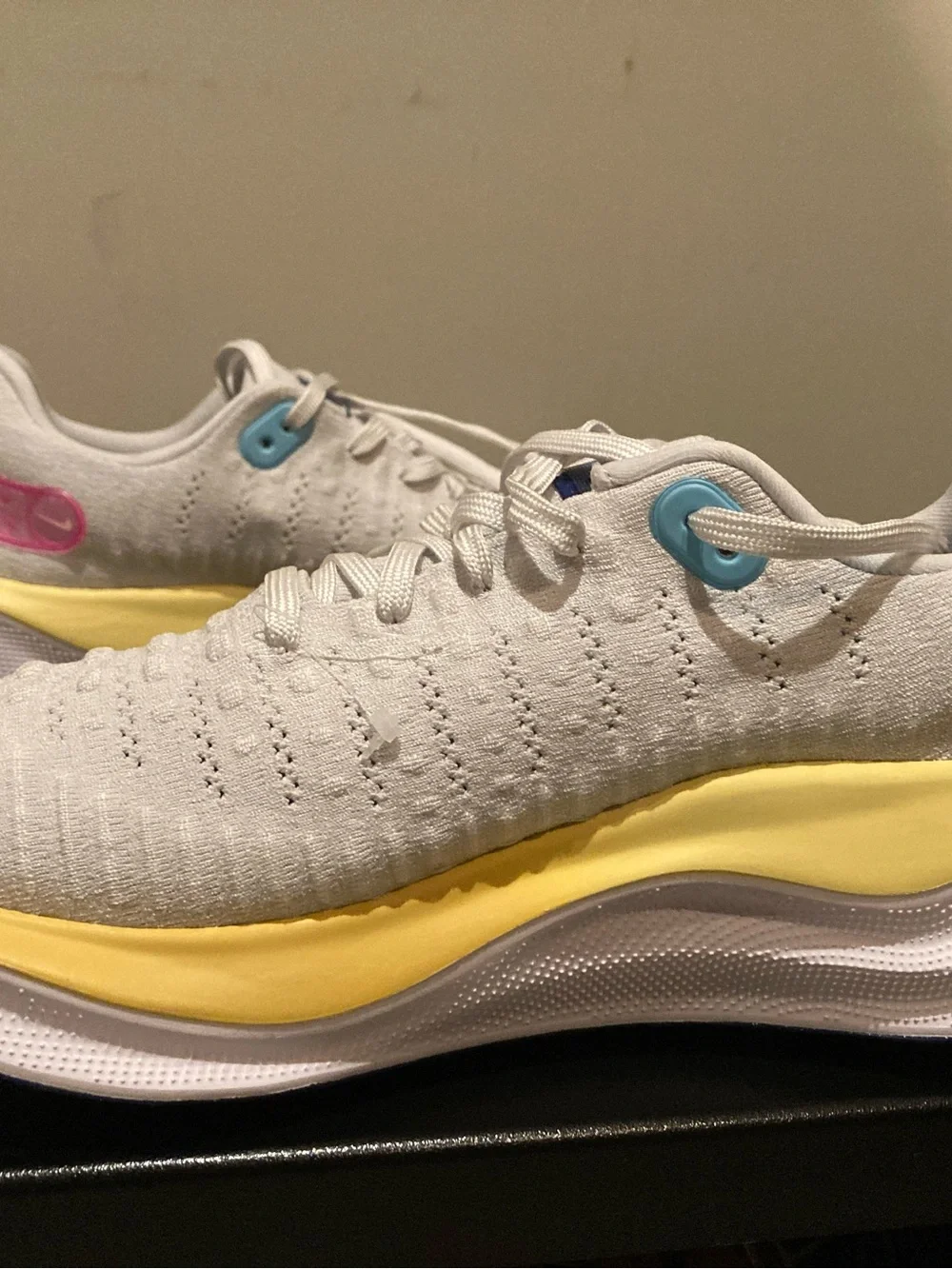 Nike White Athletic Shoes with Blue Swoosh and Yellow Midsole